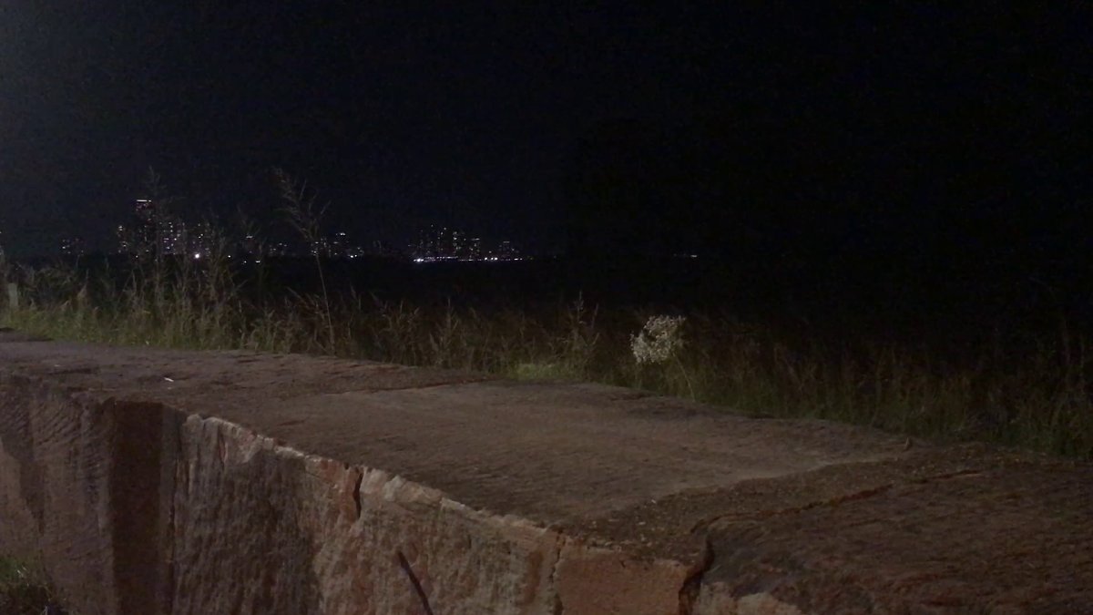 concrete slabs  in front of grass distant skyline