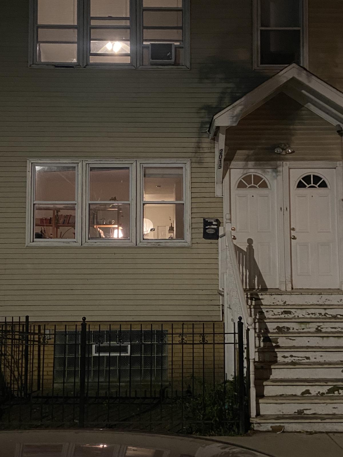 outside my apartment looking in at night
